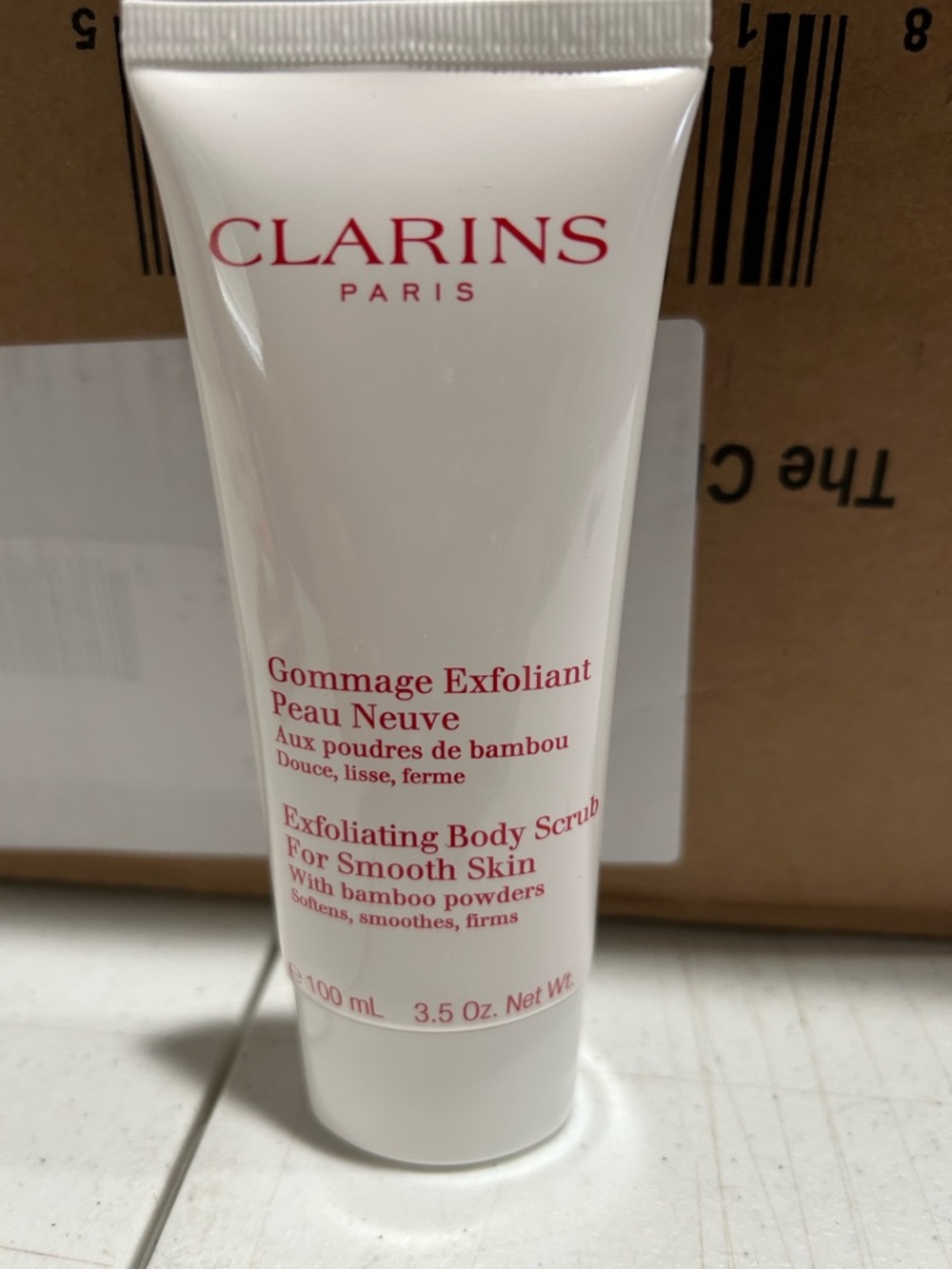 Clarins Exfoliating Body Scrub - White Tube with Red Text